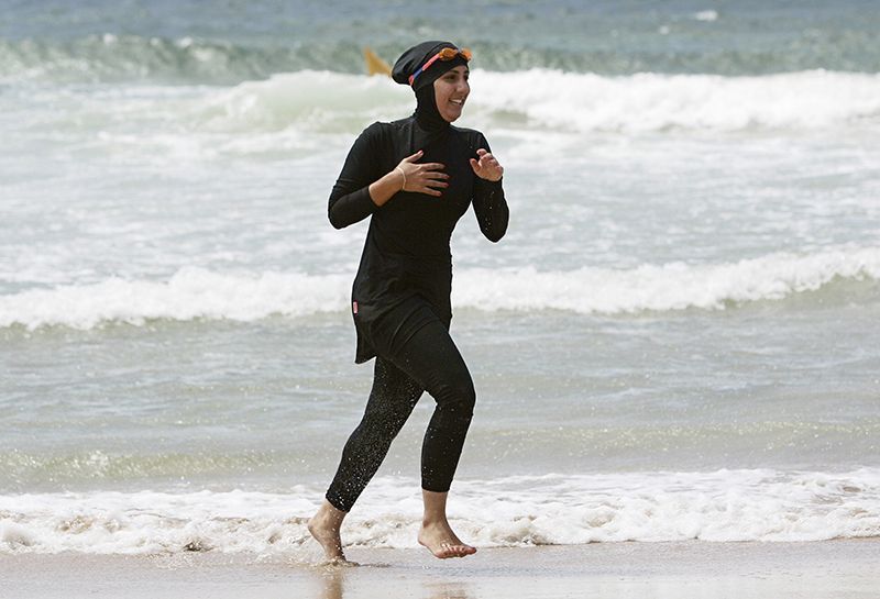 Trainee volunteer surf life saver Laalaa runs along North Cronulla Beach in Sydney