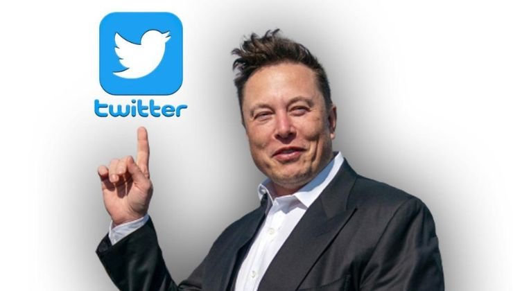 Elon Musk con il logo di Twitter