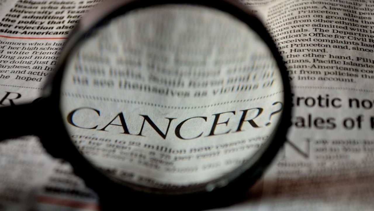 Cancro e lente di ingrandimento