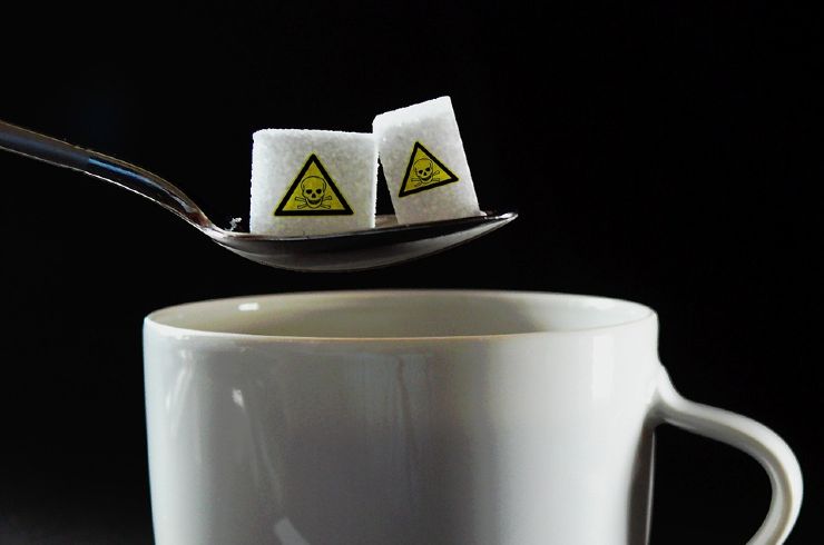 Dolcificante con segnale di pericolo